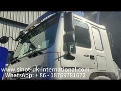 شاحنة قلاب SINOTRUK HOWO 8×4 بقوة 400 حصان + صندوق شحن خلفي بباب مزدوج بطول 7800 مم